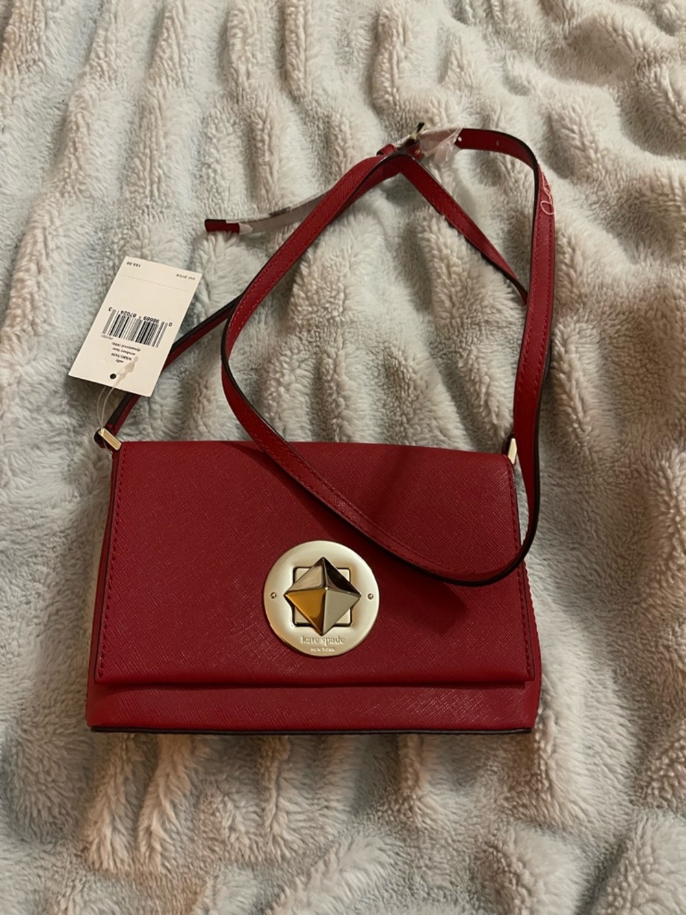 kate spade red crossbody with gold star medallion